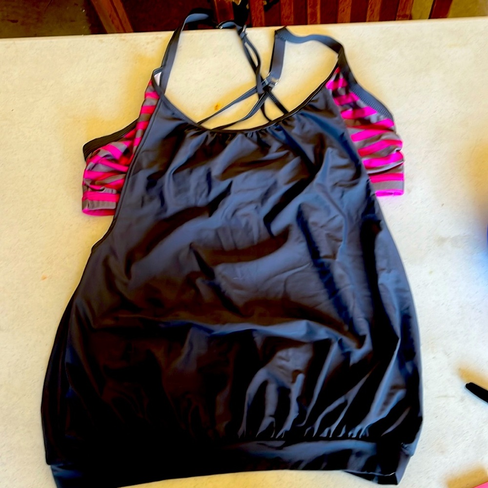 Extra large tankini top and bikini bottoms that tie on the sides. Pink/gray
